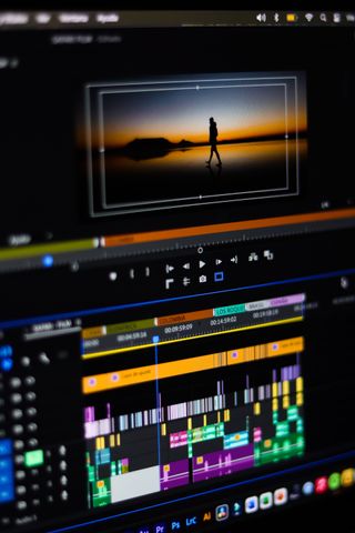 Close-up of professional video editing software interface showing colour grading timeline and preview panels